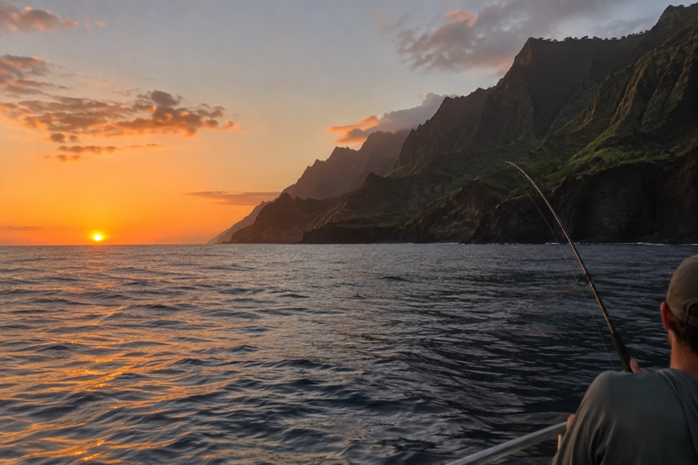 Calm evening water off the Napali Coast with the sun low on the horizon