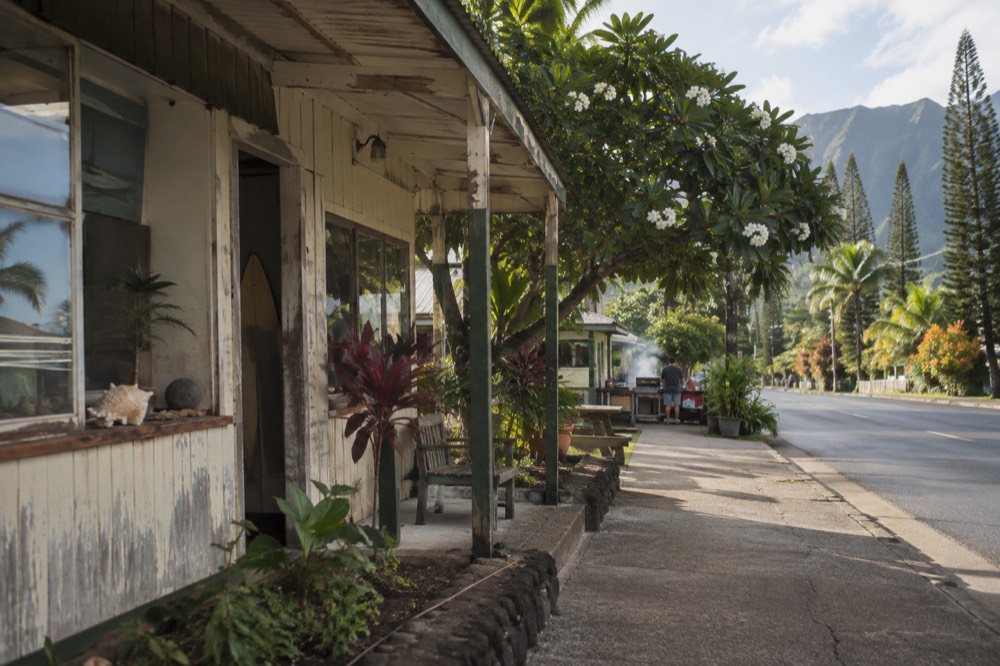 Small cafe storefront in a Hawaiian plantation style town at morning