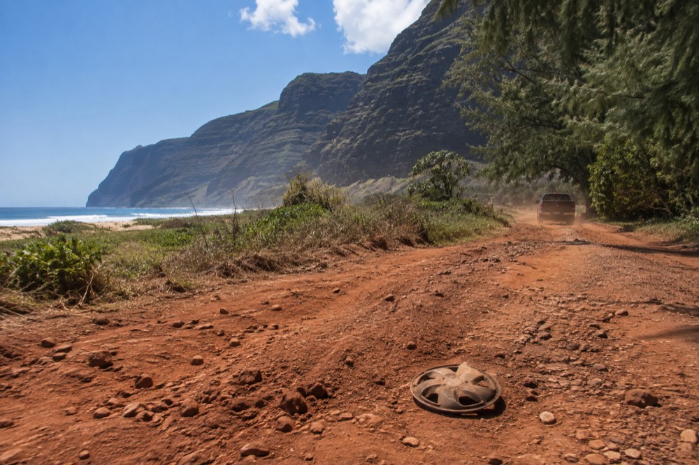 The deep red-dirt track toward Polihale on Kauai's west side