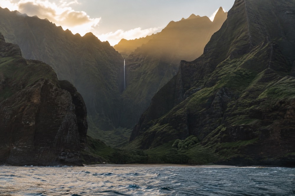 Backlit evening view up the narrow valley of Awaawapuhi on Kauai